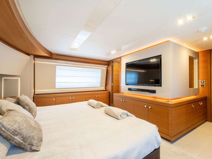 MILENA Custom Line Navetta 28 - master cabin bed and TV MILENA Custom Line Navetta 28 - master cabin bed and TV