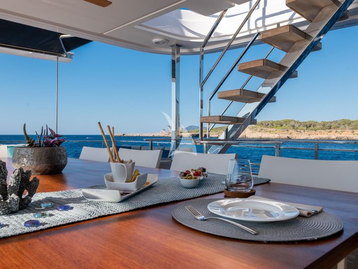 ACQUA - Ferretti Custom Line Navetta 33,aft deck alfresco dining set up