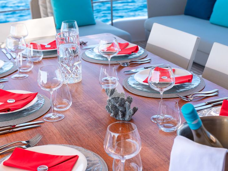 ACQUA Ferretti Custom Line Navetta 33 - formal dining set up ACQUA Ferretti Custom Line Navetta 33 - formal dining set up