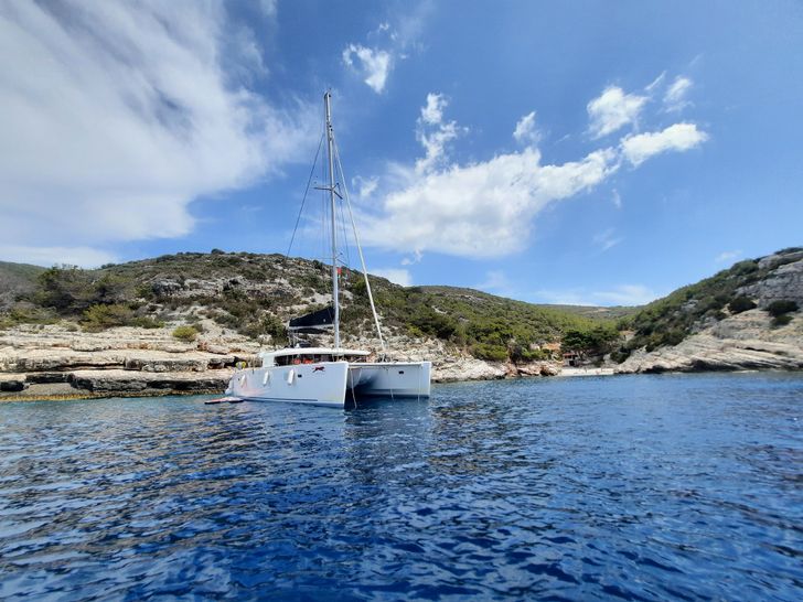 ADRIATIC CHEETAH Lagoon 450F - anchored near an island ADRIATIC CHEETAH Lagoon 450F - anchored near an island