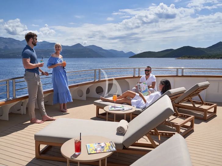 AETERNA Radez Custom Yacht 53m - guests lounging under the sun AETERNA Radez Custom Yacht 53m - guests lounging under the sun