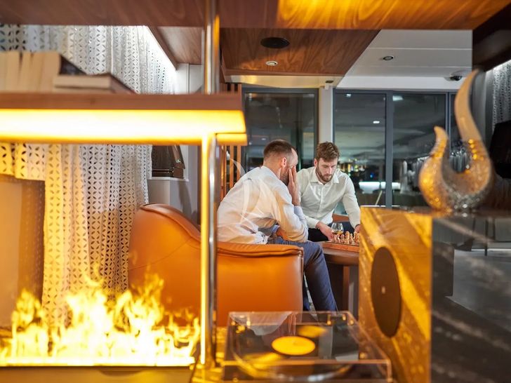 AETERNA Radez Custom Yacht 53m - guests playing board games AETERNA Radez Custom Yacht 53m - guests playing board games