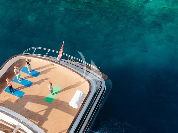 AGAPE ROSE Custom Yacht 48m - guests having a yoga session AGAPE ROSE Custom Yacht 48m - guests having a yoga session