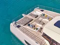 ALINA Fountaine Pajot Power 80 - foredeck with jacuzzi sunbeds and seating area ALINA Fountaine Pajot Power 80 - foredeck with jacuzzi sunbeds and seating area