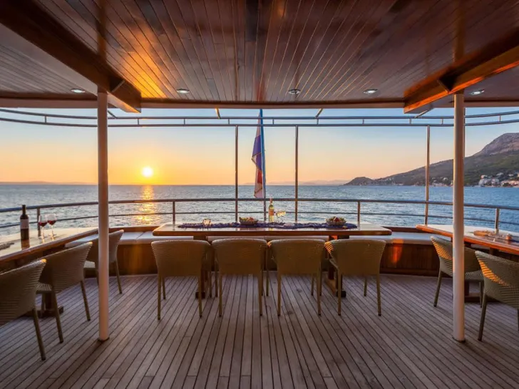 AMALIA Custom Motor Yacht 39m - aft deck dining area AMALIA Custom Motor Yacht 39m - aft deck dining area