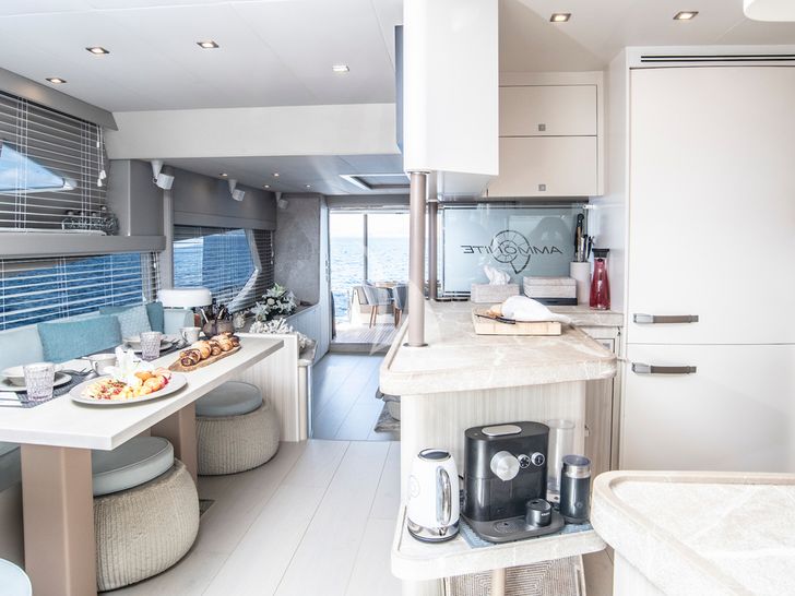 AMMONITE Numarine 78 galley and indoor dining area AMMONITE Numarine 78 galley and indoor dining area