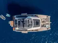 ANIMA Fountaine Pajot Power 80 - top shot anchored with the water toys ANIMA Fountaine Pajot Power 80 - top shot anchored with the water toys