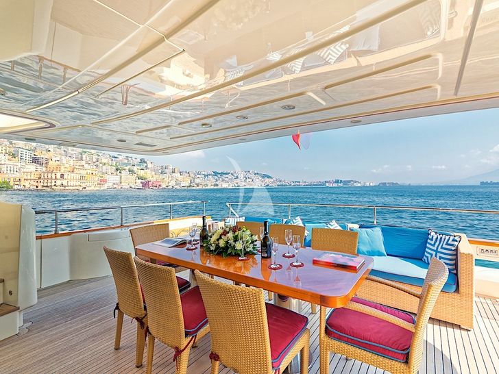 ANNE MARIE Ferretti Custom Line 97 - aft deck dining area ANNE MARIE Ferretti Custom Line 97 - aft deck dining area