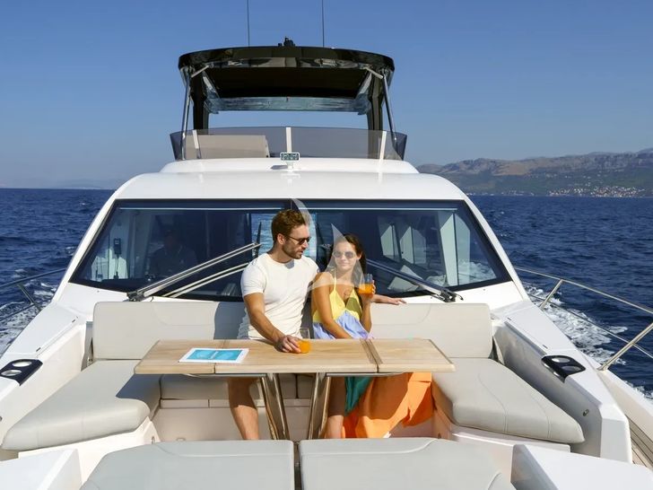 APOLLO Sunseeker Manhattan 68 - guests basking in the sun on the foredeck APOLLO Sunseeker Manhattan 68 - guests basking in the sun on the foredeck