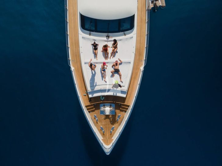 ARCHSEA HG Yachting 31m - guests basking under the sun ARCHSEA HG Yachting 31m - guests basking under the sun