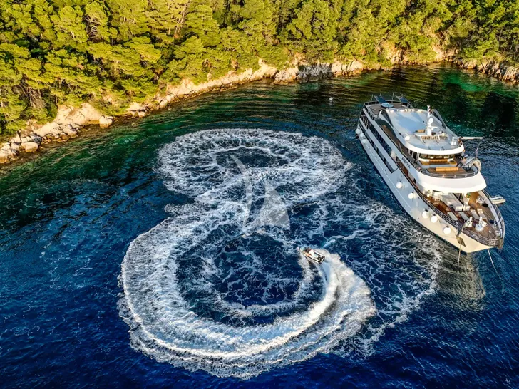 ARETHA Custom Yacht 45m - anchored near an island ARETHA Custom Yacht 45m - anchored near an island