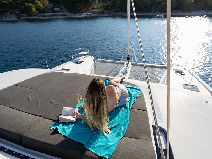 ARTISAN Lagoon 55 - guest sunbathing ARTISAN Lagoon 55 - guest sunbathing