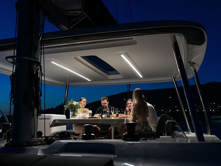 ARTISAN Lagoon 55 - guests dining on the flybridge ARTISAN Lagoon 55 - guests dining on the flybridge