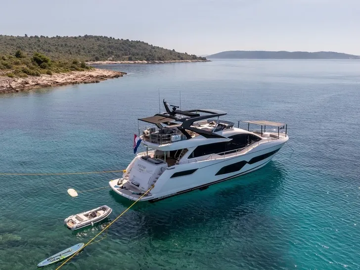 ASCEND Sunseeker 23m - anchored with the tender and paddleboard ASCEND Sunseeker 23m - anchored with the tender and paddleboard