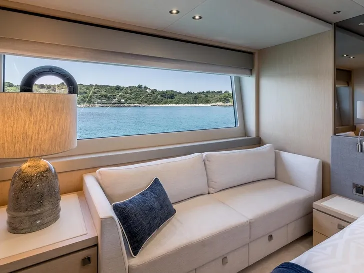 ASCEND Sunseeker 23m - master cabin couch by the glass window ASCEND Sunseeker 23m - master cabin couch by the glass window