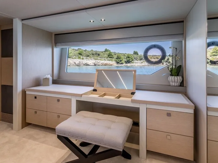 ASCEND Sunseeker 23m - master cabin vanity area by the glass window ASCEND Sunseeker 23m - master cabin vanity area by the glass window