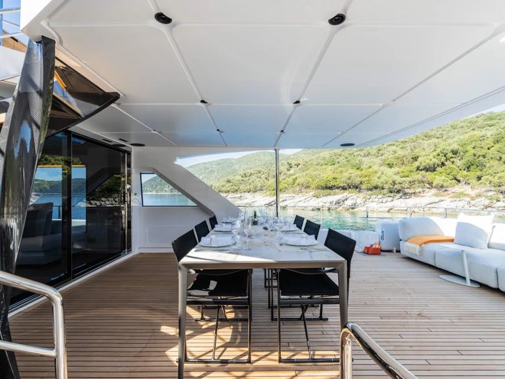 AT ONE Ferretti Custom Line Navetta 30 - sky deck dining area AT ONE Ferretti Custom Line Navetta 30 - sky deck dining area