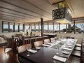 ALILA PURNAMA Phinisi Sailing Yacht 46m - indoor dining area ALILA PURNAMA Phinisi Sailing Yacht 46m - indoor dining area