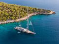 BARACUDA VALETTA Perini Navi Sailing Yacht 50m anchored near an island