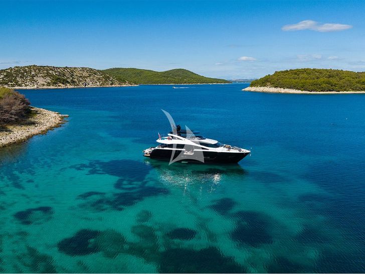 BLACK MAMBA Sunseeker 86 Yacht - anchored near the islands BLACK MAMBA Sunseeker 86 Yacht - anchored near the islands