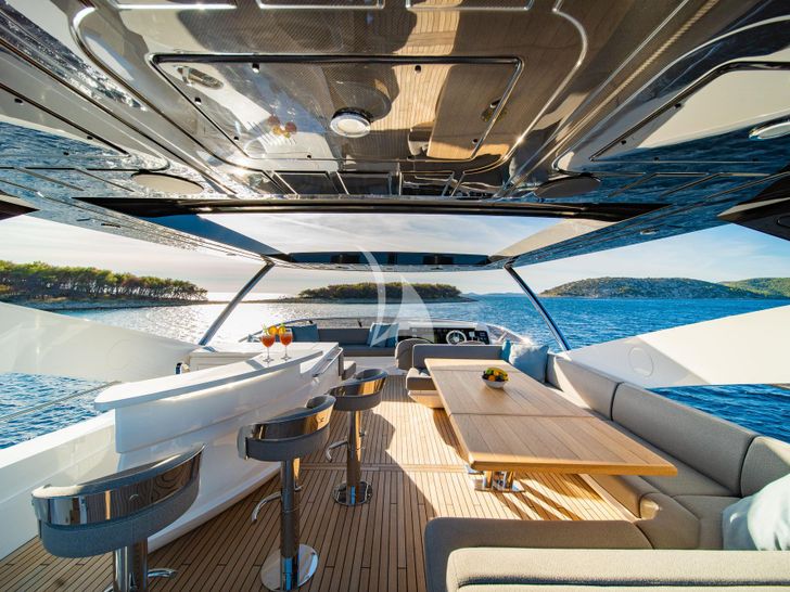 BLACK MAMBA Sunseeker 86 Yacht - flybridge dining area and minibar BLACK MAMBA Sunseeker 86 Yacht - flybridge dining area and minibar