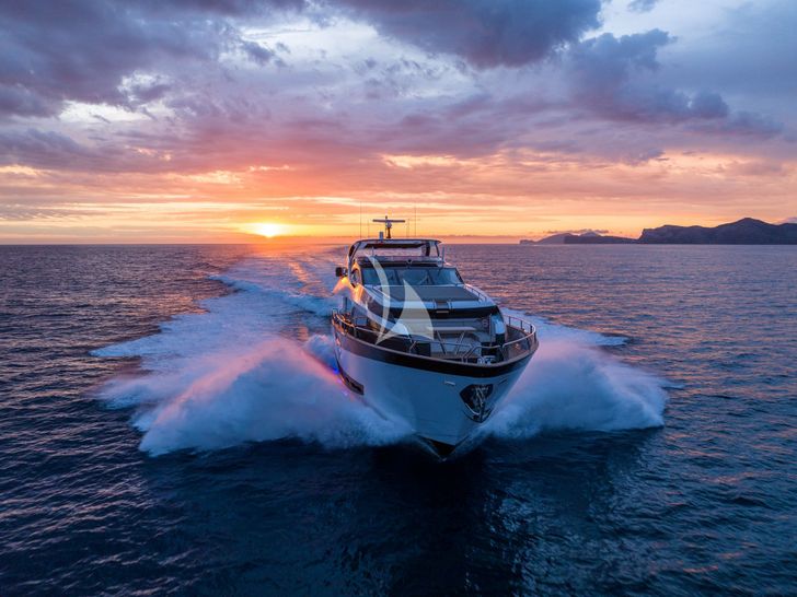 BLUE INFINITY ONE Sunseeker 95 Yacht cruising under the sunset