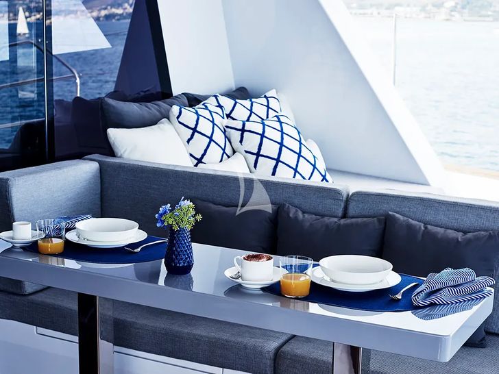BLUE DEER Sunreef 74 - alfresco dining set up daytime BLUE DEER Sunreef 74 - alfresco dining set up daytime