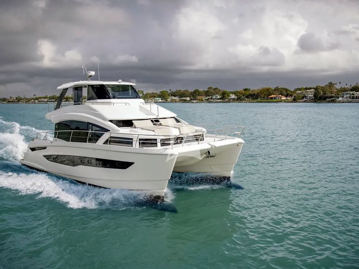 BOLUBO II Aquila 54 Power Catamaran - cruising across the waterline BOLUBO II Aquila 54 Power Catamaran - cruising across the waterline