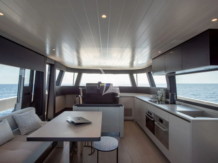 CC Bluegame BGX62 - dining table and galley CC Bluegame BGX62 - dining table and galley