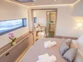 CORE Fountaine Pajot Power 67 - master cabin bed and bathroom CORE Fountaine Pajot Power 67 - master cabin bed and bathroom