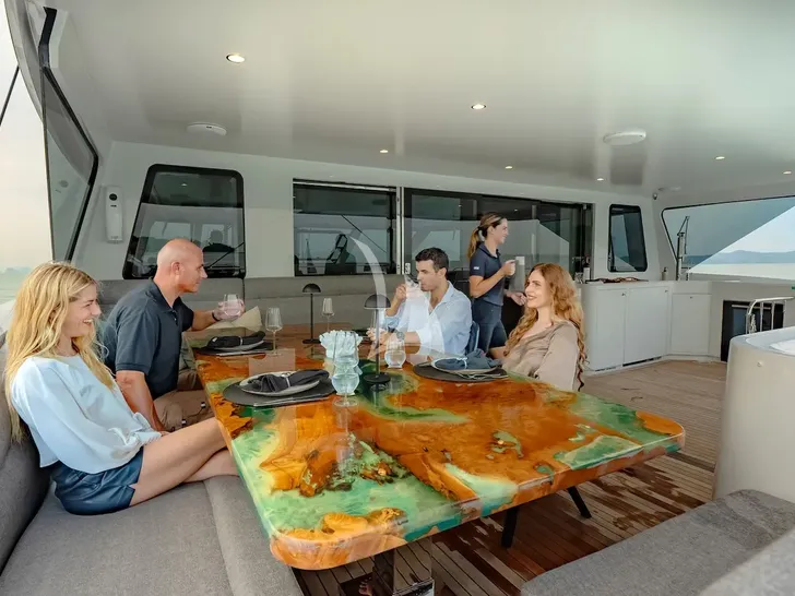 CRAZY LOVE Hudson HH88 - guests enjoying the aft deck lounge and dining area CRAZY LOVE Hudson HH88 - guests enjoying the aft deck lounge and dining area
