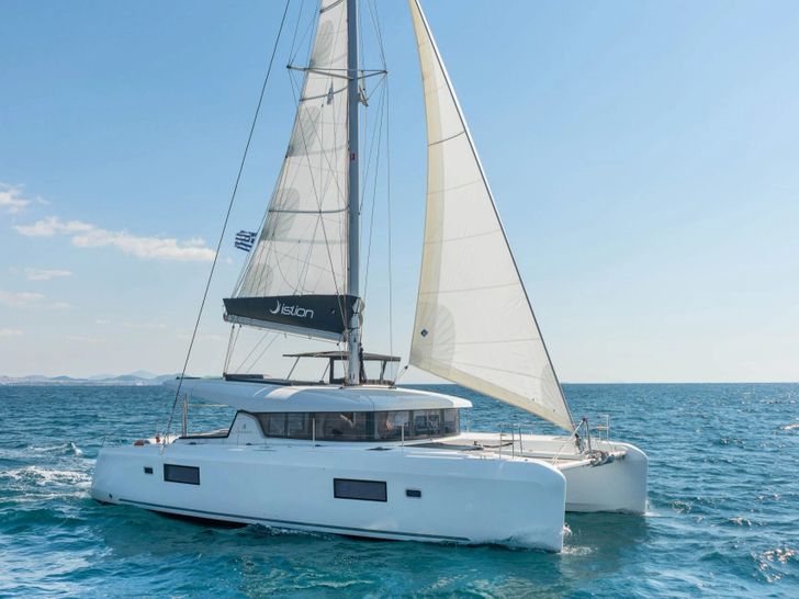 DREAM WATERS Lagoon 42 cruising side view DREAM WATERS Lagoon 42 cruising side view