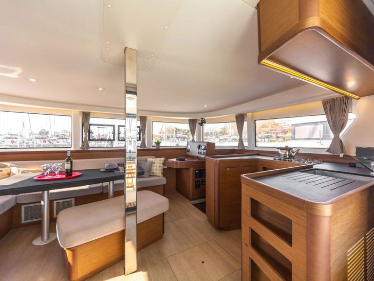 DREAM WATERS Lagoon 42 interior with dining area and galley DREAM WATERS Lagoon 42 interior with dining area and galley