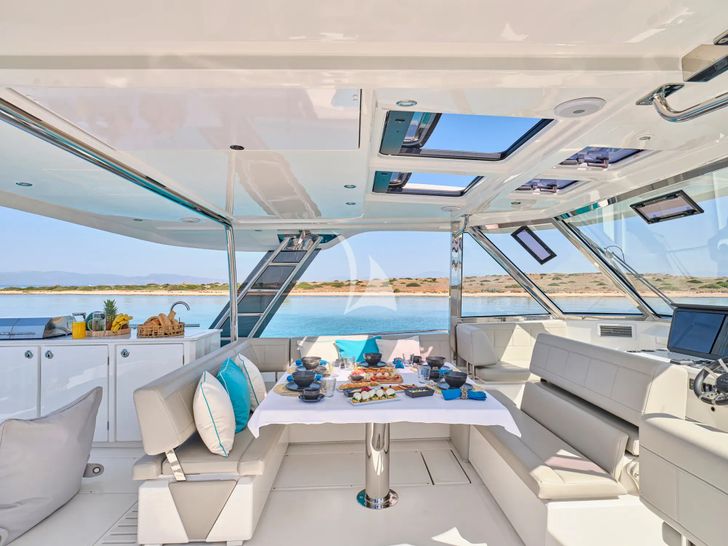 EXPLORION Aquila 54 - flybridge dining area EXPLORION Aquila 54 - flybridge dining area