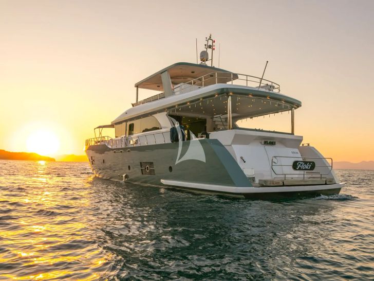 FLOKI Custom 78 Motor Yacht - anchored aft shot under the sunset FLOKI Custom 78 Motor Yacht - anchored aft shot under the sunset