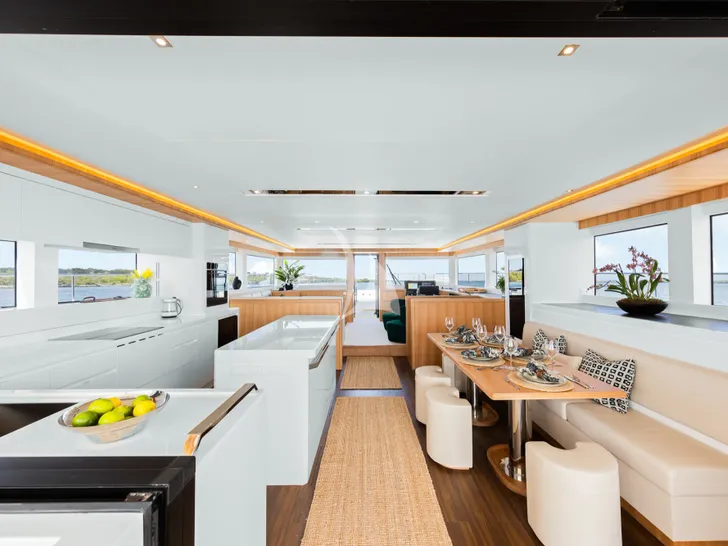 GINGER Iliad 62 - saloon dining area and galley GINGER Iliad 62 - saloon dining area and galley