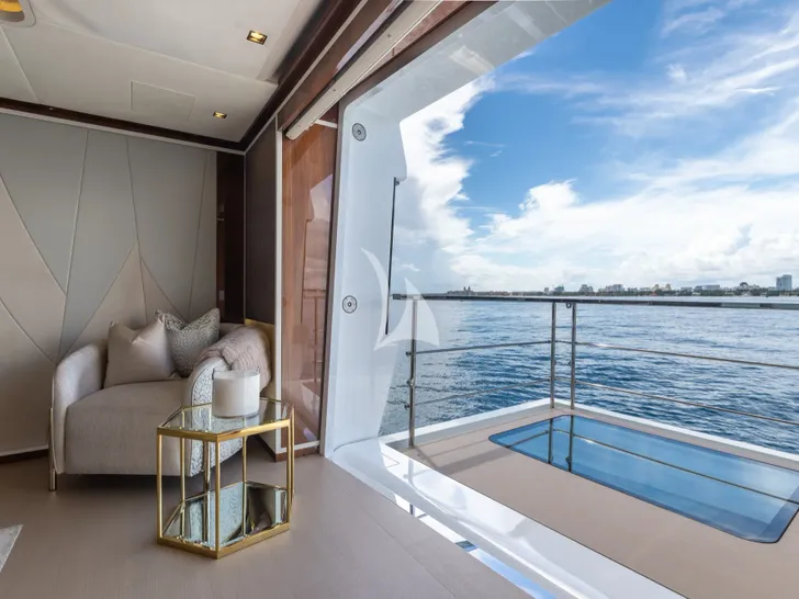 VELOCITY Mangusta GranSport 54 - master cabin seat by the balcony VELOCITY Mangusta GranSport 54 - master cabin seat by the balcony