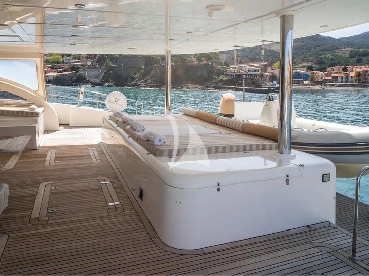 HOUBARA Sunreef 82 DD - aft deck bronzing area and tender HOUBARA Sunreef 82 DD - aft deck bronzing area and tender