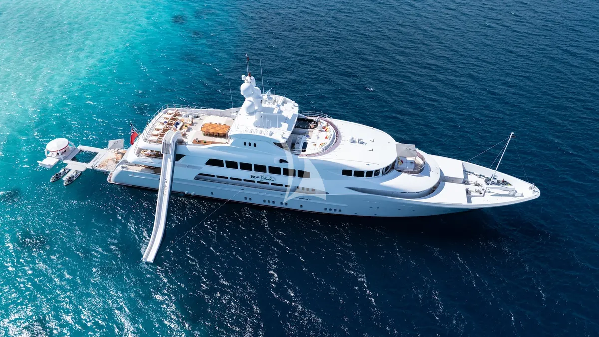 IRON BLONDE Trinity Yacht 60m - aerial shot at anchor with the water toys ready