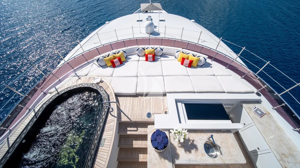 IRON BLONDE Trinity Yacht 60m - overhead shot of the jacuzzi sunbed and bar on sundeck