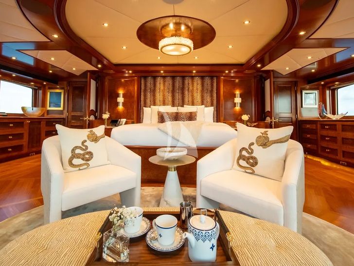 IRON BLONDE Trinity Yacht 60m - owner's suite lounge and bed IRON BLONDE Trinity Yacht 60m - owner's suite lounge and bed