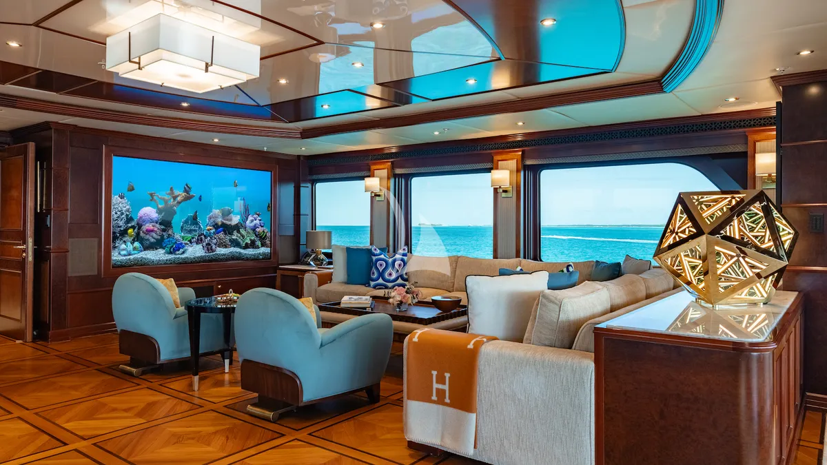 IRON BLONDE Trinity Yacht 60m - skylounge salon with a large LED TV