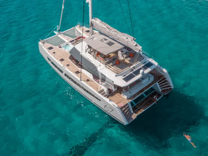 ISOLA Fountaine Pajot Alegria 67 - anchored aerial shot ISOLA Fountaine Pajot Alegria 67 - anchored aerial shot