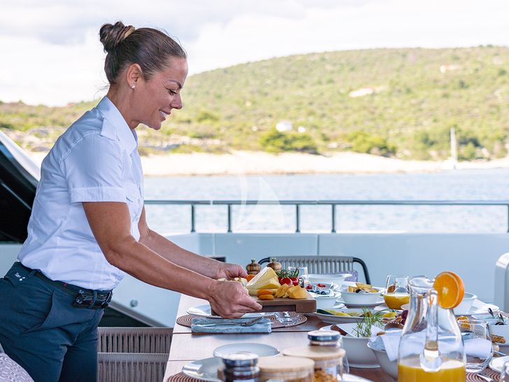 JOURNEY - Sanlorenzo SL102,stewardess arranging the alfresco dining area