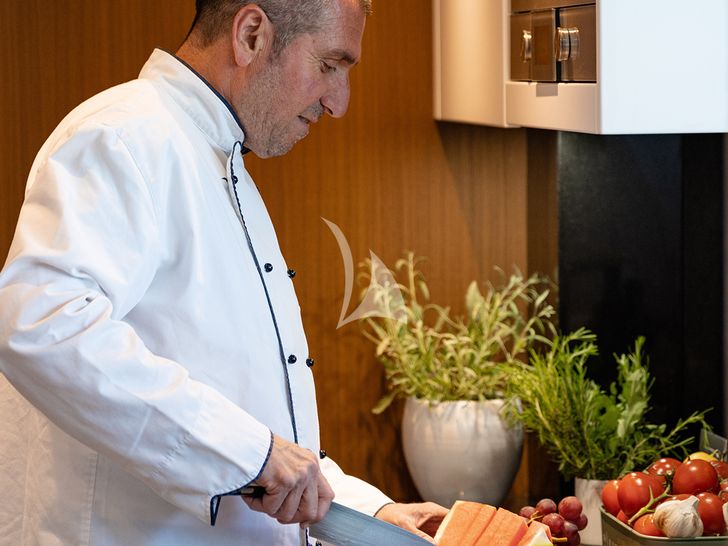 JOURNEY Sanlorenzo SL102 - chef preparing fruit cuts JOURNEY Sanlorenzo SL102 - chef preparing fruit cuts