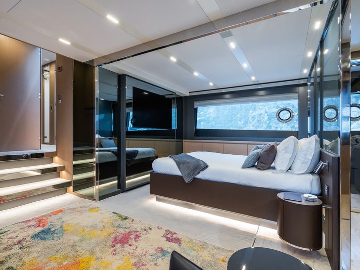 KAR Riva Folgore 88 - master cabin bed and TV KAR Riva Folgore 88 - master cabin bed and TV