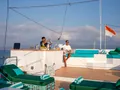 KAYRA Phinisi 38m - guest enjoying the sundeck bar with the bartender KAYRA Phinisi 38m - guest enjoying the sundeck bar with the bartender