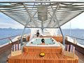 KUDANIL Custom Motor Yacht 50m - guest in the jacuzzi KUDANIL Custom Motor Yacht 50m - guest in the jacuzzi