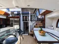 LIZZI Lazzara 75 dining and galley other angle LIZZI Lazzara 75 dining and galley other angle