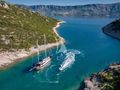 LOTUS Gulet 30m - anchored near an island LOTUS Gulet 30m - anchored near an island